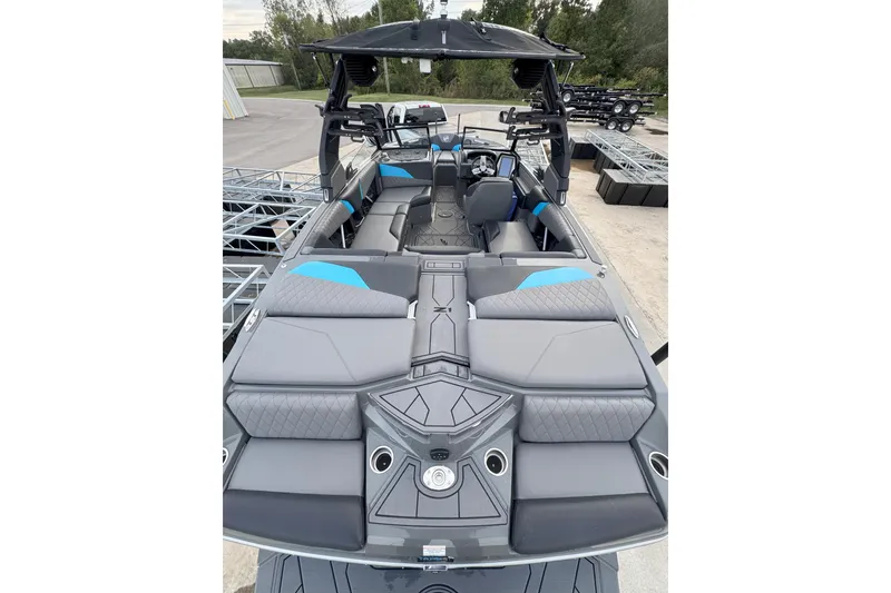 Slide: The Image of 2023 Tigé Z1 boat interior with gray and blue seating, modern design. - 3