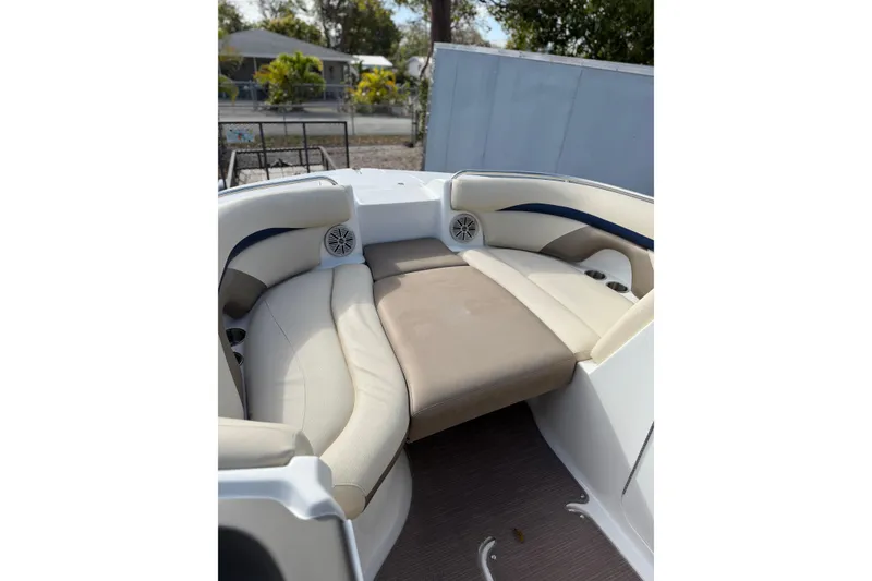Slide: The Image of 2017 Hurricane SunDeck 2200 OB boat interior with cushioned seating and speakers. - 10