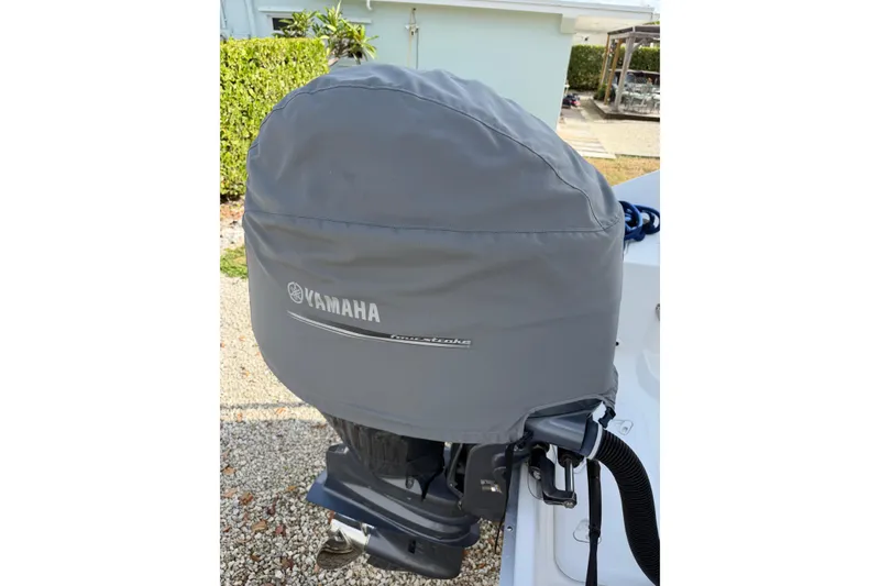 Slide: The Image of Yamaha outboard motor covered, attached to 2017 Hurricane SunDeck 2200 OB boat. - 15
