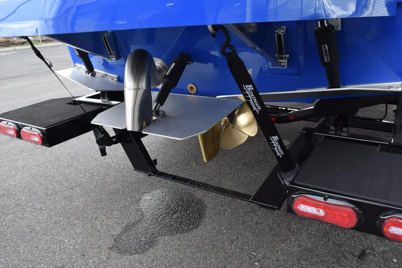 Slide: The Image of 2025 Moomba Max boat rear view with propeller and trailer details. - 3