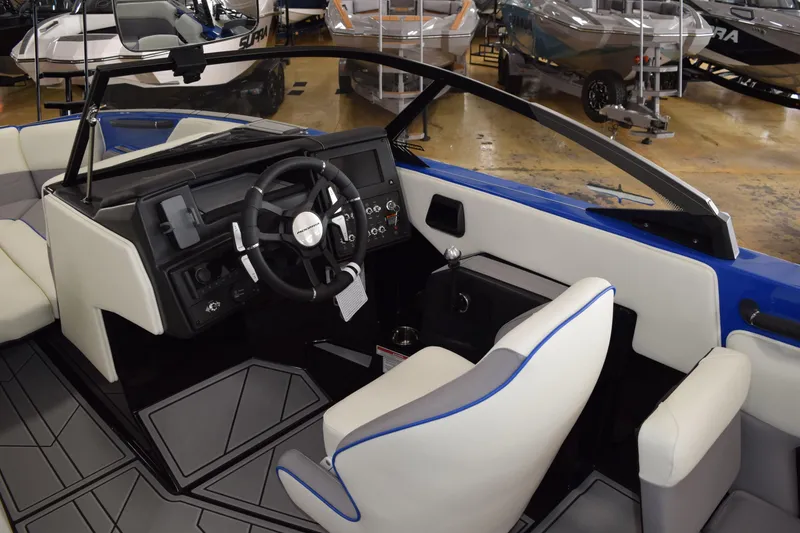Slide: The Image of 2025 Moomba Max boat interior with modern dashboard and steering wheel design. - 4