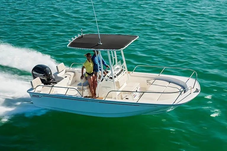 The Image of Manufacturer Provided Image: 2026 Boston Whaler 190 Montauk boat cruising on clear turquoise water. - 0