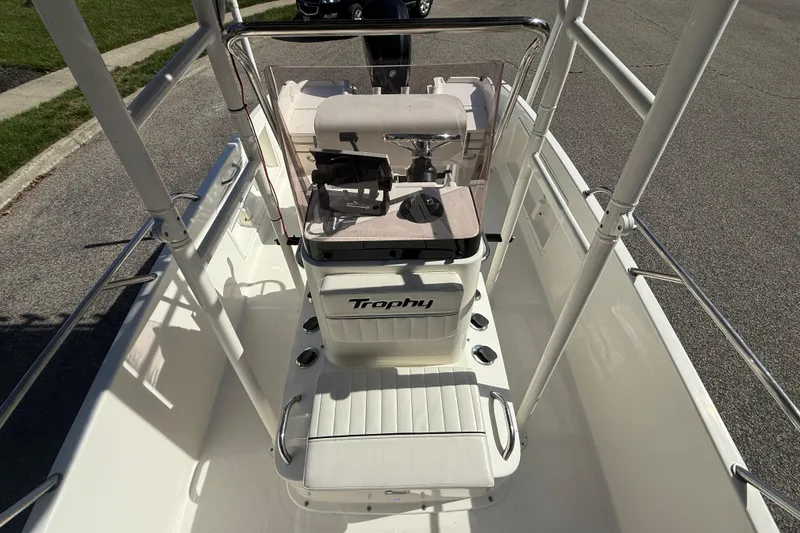 Slide: The Image of 2022 Bayliner Trophy T18Bay boat interior with steering console and seating. - 14