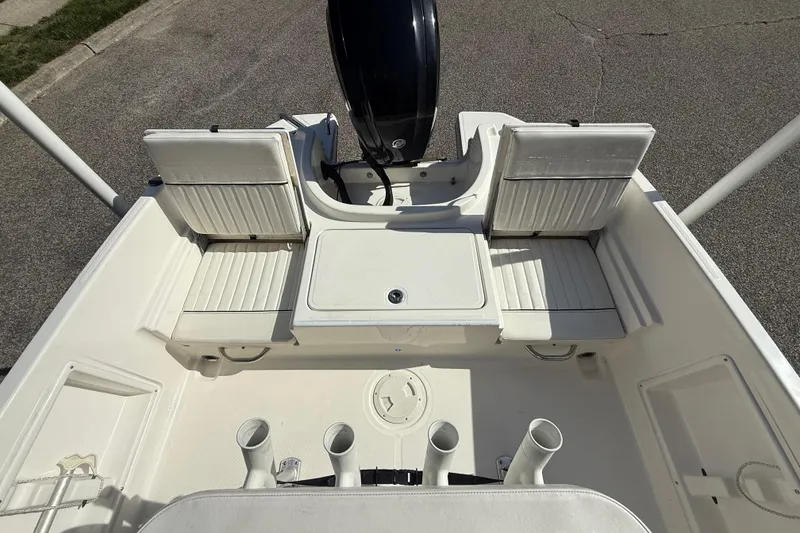 Slide: The Image of 2022 Bayliner Trophy T18Bay boat interior with seating and rod holders. - 16