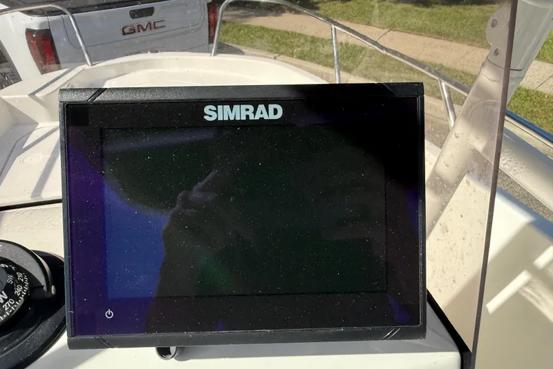 Slide: The Image of Simrad display on 2022 Bayliner Trophy T18Bay boat dashboard. - 21