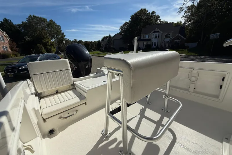 Slide: The Image of 2022 Bayliner Trophy T18Bay boat interior with seating and Mercury outboard motor. - 24