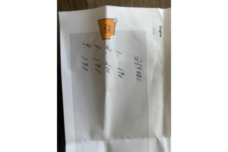Slide: The Image of Folded paper with handwritten numbers, related to 2022 Bayliner Trophy T18Bay boat. - 26
