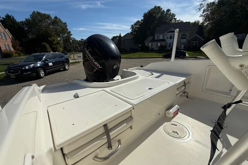 Slide: The Image of 2022 Bayliner Trophy T18Bay boat with Mercury engine in residential area. - 9