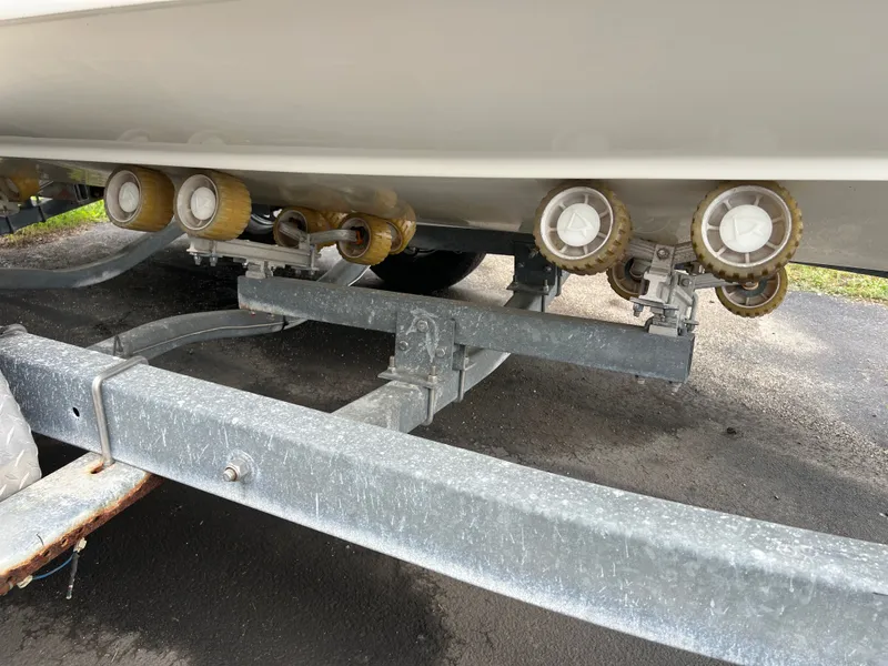 Slide: The Image of 2004 Hydra-Sports Lightning 230 WA on trailer with rollers. - 36