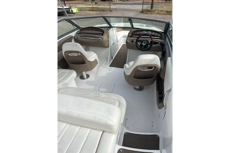 Slide: The Image of Interior of a 2008 Cobalt 212 boat with white and brown seating. - 2
