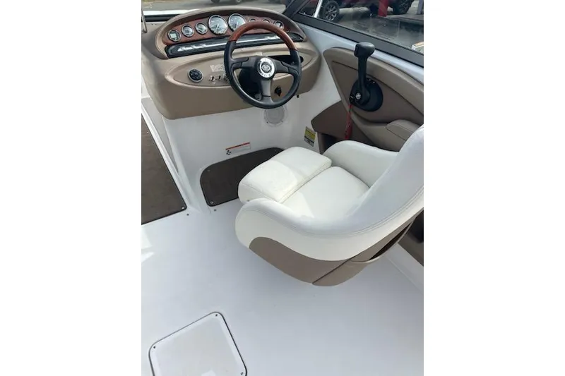 Slide: The Image of 2008 Cobalt 212 boat interior with steering wheel and control panel. - 3