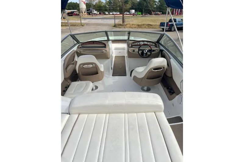 Slide: The Image of Interior view of a 2008 Cobalt 212 boat with white and beige seating. - 5