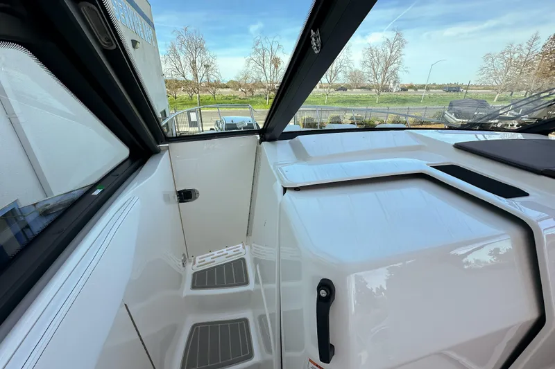 Slide: The Image of 2026 Sea Ray Sundancer 320 boat interior with sleek white design and modern features. - 21