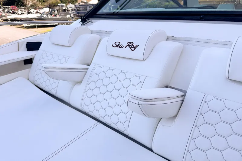 Slide: The Image of Luxurious seating on 2026 Sea Ray Sundancer 320 boat with elegant white upholstery. - 38