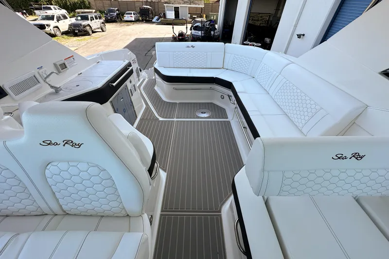 Slide: The Image of Luxurious interior of 2026 Sea Ray Sundancer 320 yacht with white seating and modern design. - 39