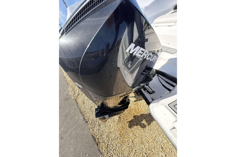 Slide: The Image of Outboard motor on a 2020 Monterey M-225 boat, featuring a Mercury engine. - 18