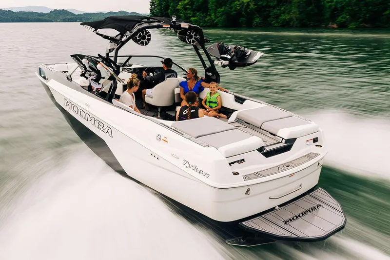 Slide: The Image of Manufacturer Provided Image: 2025 Moomba Tykon boat cruising on a lake with passengers enjoying the ride. - 18