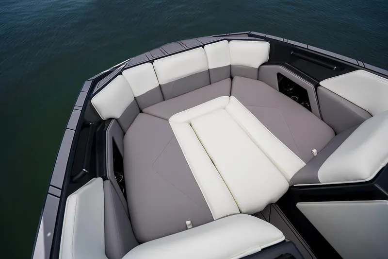 Slide: The Image of Manufacturer Provided Image: 2025 Moomba Tykon boat interior with gray and white cushioned seating. - 19