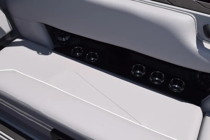 Slide: The Image of 2025 Moomba Tykon boat interior with sleek seating and built-in cup holders. - 8