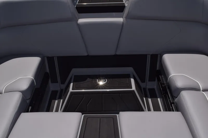 Slide: The Image of 2025 Moomba Tykon boat interior with sleek gray seating and modern design. - 9