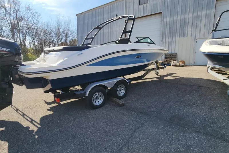 Slide: The Image of 2021 Sea Ray SPX 210 Outboard boat on trailer, parked outdoors. - 3