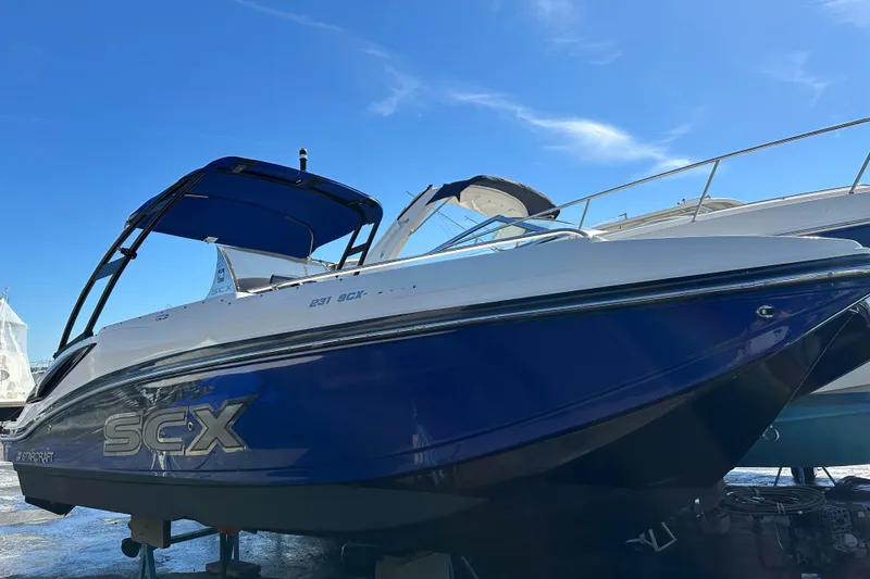The Image of 2019 Starcraft Crossover 231 SCX IO SURF boat with blue and white exterior. - 0