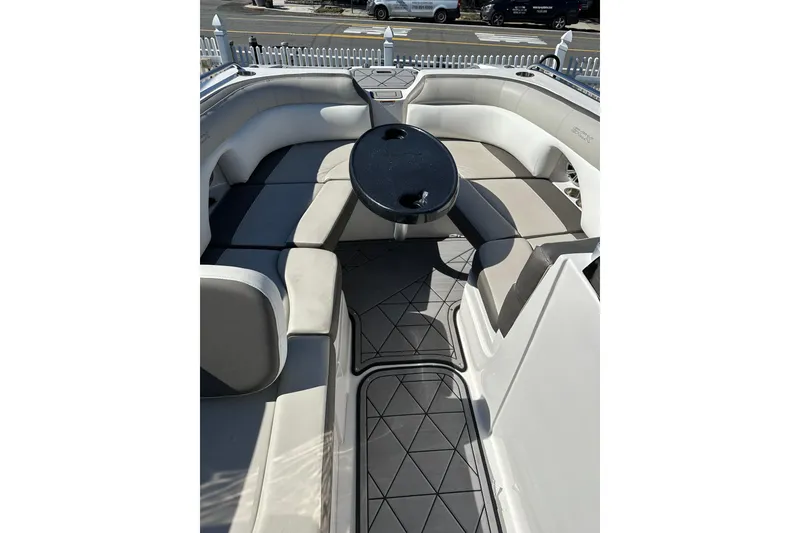 Slide: The Image of 2019 Starcraft Crossover 231 SCX IO SURF boat interior with seating and table. - 11