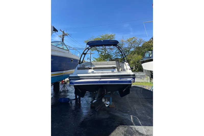 Slide: The Image of 2019 Starcraft Crossover 231 SCX IO SURF boat on display outdoors. - 12