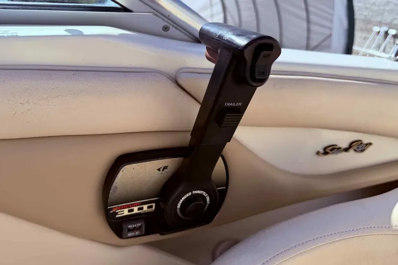 Slide: The Image of Throttle control of a 2000 Sea Ray 210 Sundeck boat interior. - 12