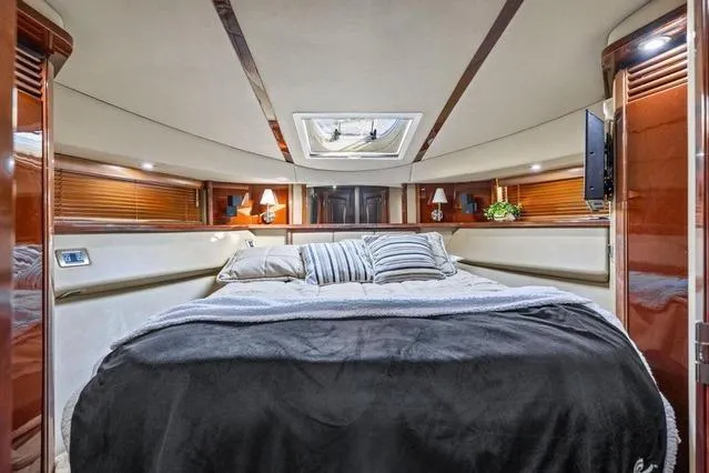 Slide: The Image of Luxurious 2007 Sea Ray 52 Sedan Bridge yacht interior with cozy bedroom and elegant decor. - 32