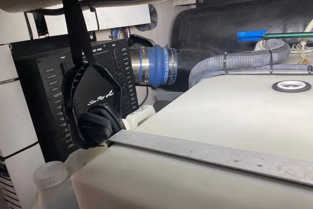 Slide: The Image of Engine room of 2007 Sea Ray 52 Sedan Bridge with visible components and wiring. - 46