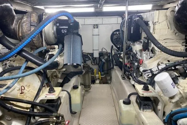 Slide: The Image of Engine room of 2007 Sea Ray 52 Sedan Bridge yacht, showcasing mechanical components and systems. - 48