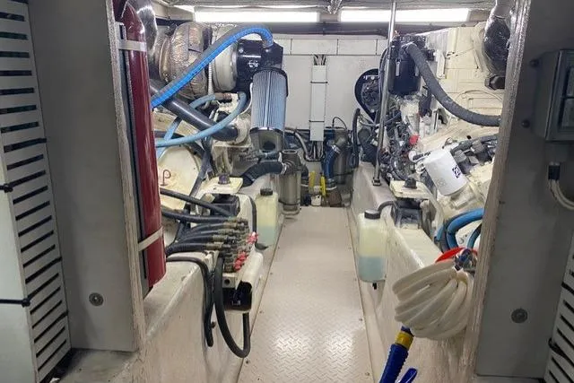 Slide: The Image of Engine room of a 2007 Sea Ray 52 Sedan Bridge with visible machinery and equipment. - 51