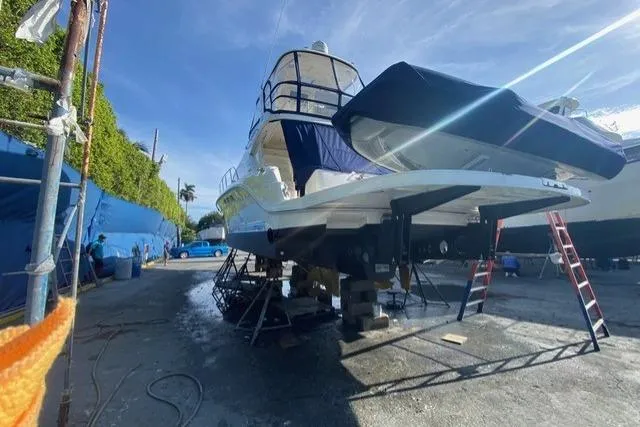 Slide: The Image of 2007 Sea Ray 52 Sedan Bridge yacht on dry dock, undergoing maintenance. - 9