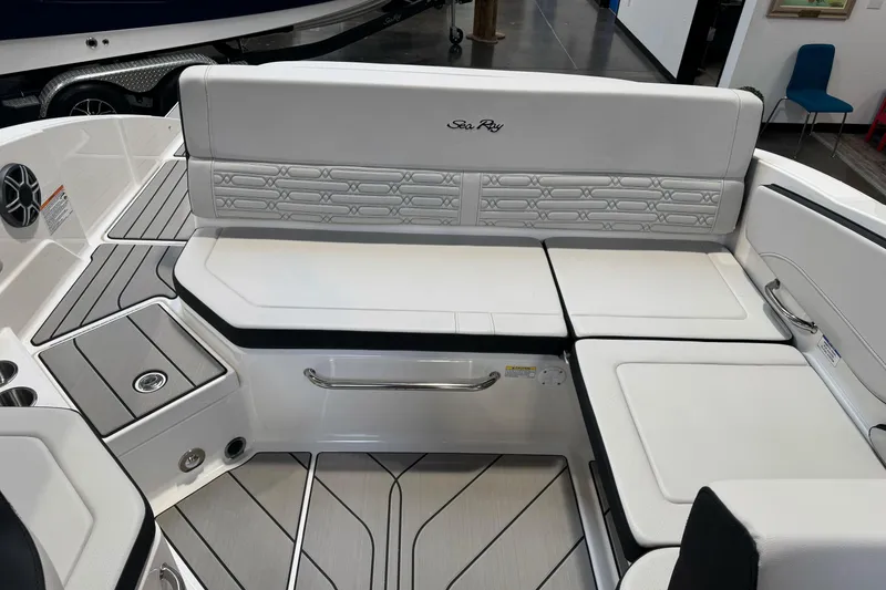 Slide: The Image of 2026 Sea Ray SPX 210 boat interior with sleek white seating and modern design. - 14