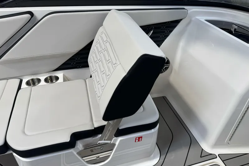 Slide: The Image of 2026 Sea Ray SPX 210 boat interior with white seating and cup holders. - 20
