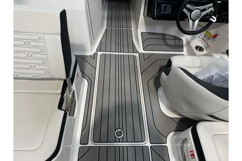 Slide: The Image of 2026 Sea Ray SPX 210 interior with sleek seating and modern dashboard design. - 23