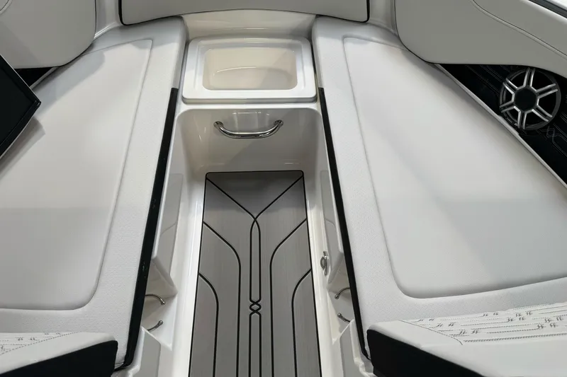 Slide: The Image of Interior view of 2026 Sea Ray SPX 210 boat, featuring sleek seating and storage. - 29