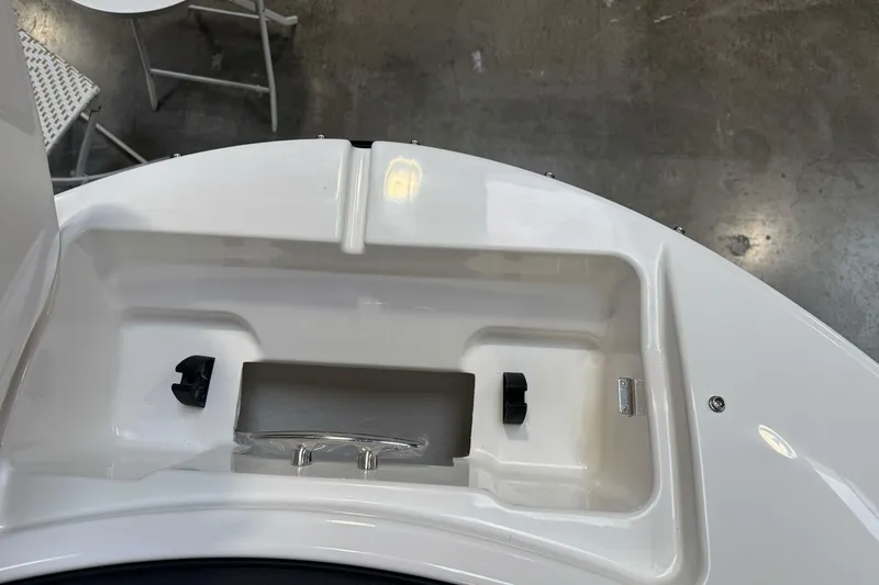 Slide: The Image of 2026 Sea Ray SPX 210 boat storage compartment with sleek white finish. - 33