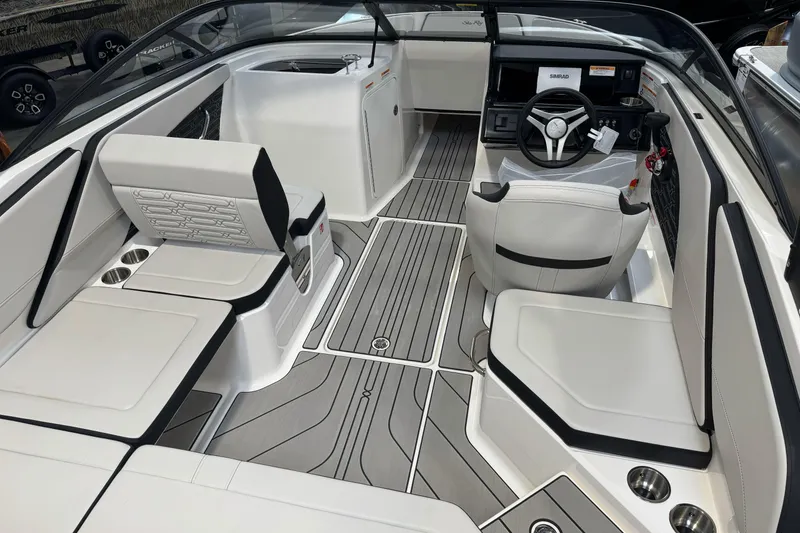 Slide: The Image of 2026 Sea Ray SPX 210 boat interior with sleek seating and modern dashboard design. - 38