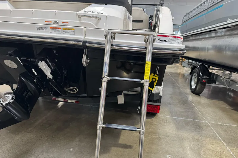 Slide: The Image of Rear view of 2026 Sea Ray SPX 210 boat with ladder and engine details. - 6