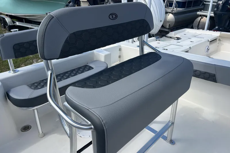 Slide: The Image of 2026 Defiance Catalina 210 boat seating with sleek gray upholstery and modern design. - 10