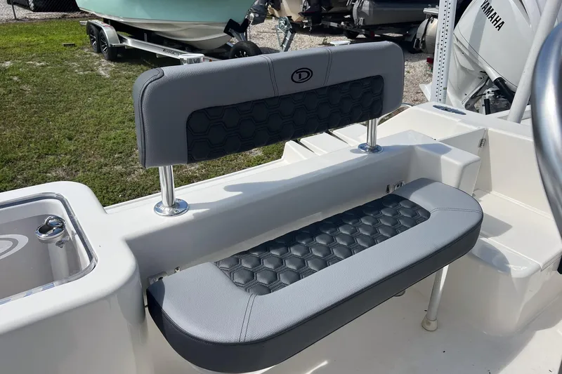 Slide: The Image of Defiance Catalina 210 boat seating, 2026 model, featuring gray upholstery with hexagonal pattern design. - 12