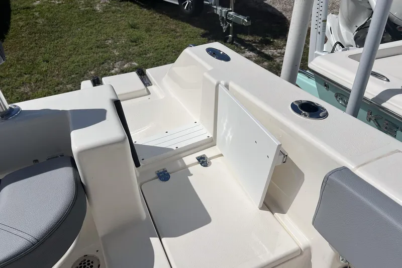 Slide: The Image of 2026 Defiance Catalina 210 boat interior with seating and storage compartments. - 16