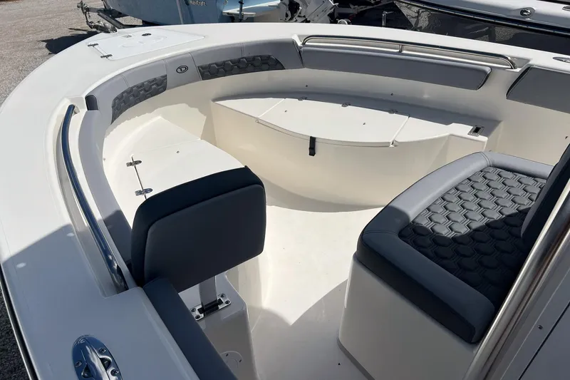Slide: The Image of 2026 Defiance Catalina 210 boat interior with cushioned seating and storage compartments. - 18