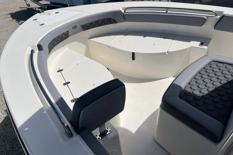 Slide: The Image of Interior of 2026 Defiance Catalina 210 boat with cushioned seating and storage compartments. - 19