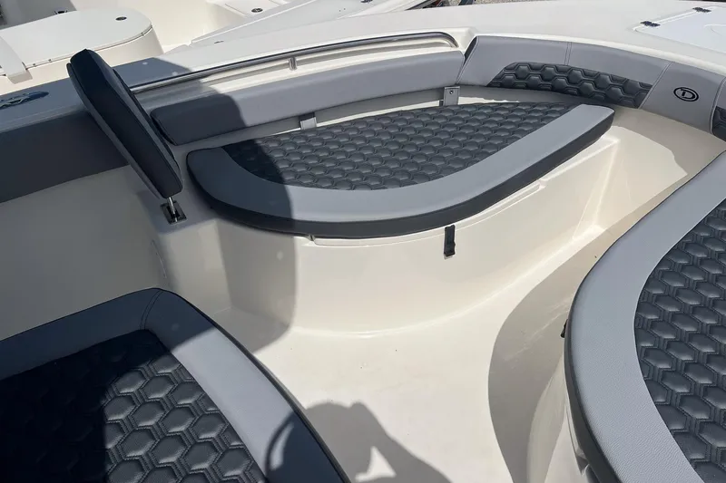 Slide: The Image of Interior seating of 2026 Defiance Catalina 210 boat with cushioned benches. - 21