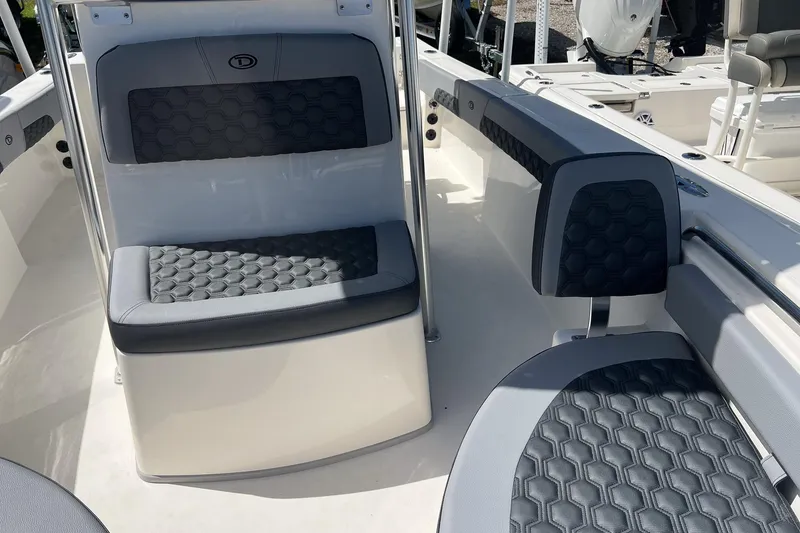 Slide: The Image of 2026 Defiance Catalina 210 boat interior with hexagonal-patterned seating and modern design. - 22