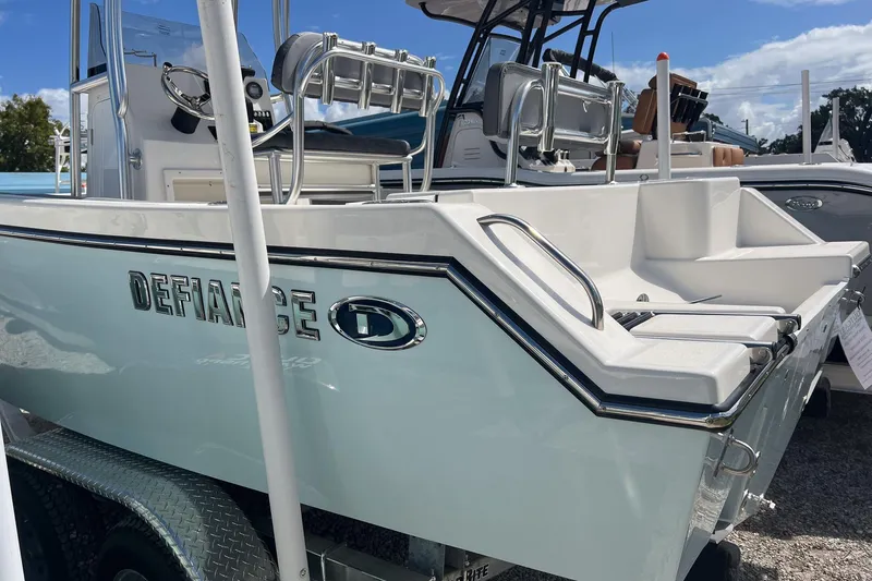 Slide: The Image of 2026 Defiance Catalina 210 boat displayed on a trailer under a clear blue sky. - 3