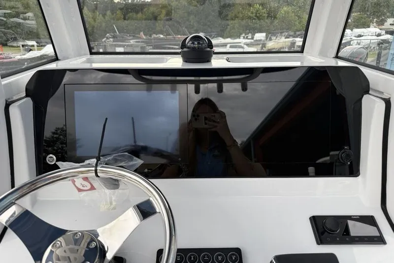 Slide: The Image of 2026 Sportsman Open 212 Center Console dashboard with steering wheel and navigation display. - 15